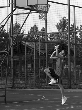 Boy playing basketball.